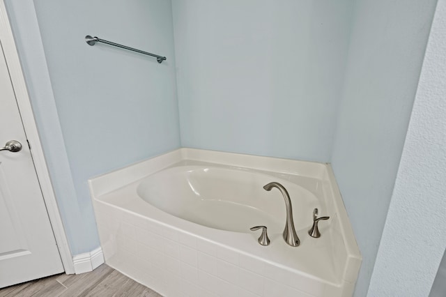 4672 SW Wade Dr, Port Saint Lucie, FL 34953 - full bathroom featuring a garden tub and wood finished floors