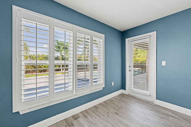 4672 SW Wade Dr, Port Saint Lucie, FL 34953 - spare room with baseboards and wood finished floors