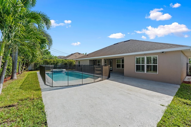 4672 SW Wade Dr, Port Saint Lucie, FL 34953 - view of swimming pool featuring a patio area and a pool with connected hot tub