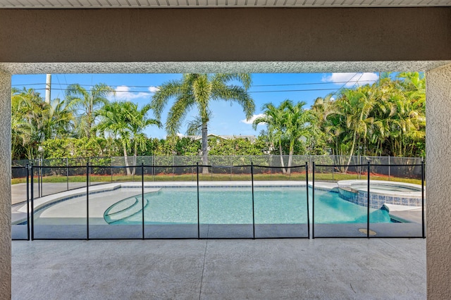 4672 SW Wade Dr, Port Saint Lucie, FL 34953 - view of swimming pool featuring a patio and a pool with connected hot tub