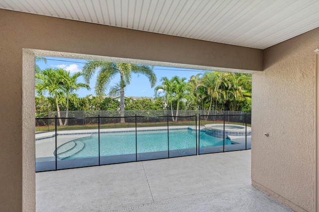 4672 SW Wade Dr, Port Saint Lucie, FL 34953 - view of pool with a patio area, a fenced backyard, and a pool with connected hot tub