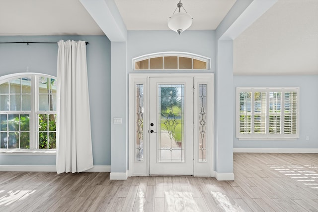 4672 SW Wade Dr, Port Saint Lucie, FL 34953 - foyer entrance featuring wood finished floors and baseboards