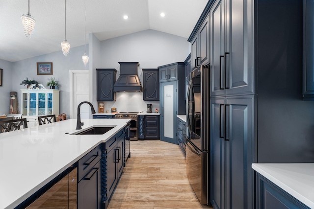 10 Copaire Rd, Sewalls Point, FL 34996 - kitchen with a sink, vaulted ceiling, custom exhaust hood, smart refrigerator, and pendant lighting