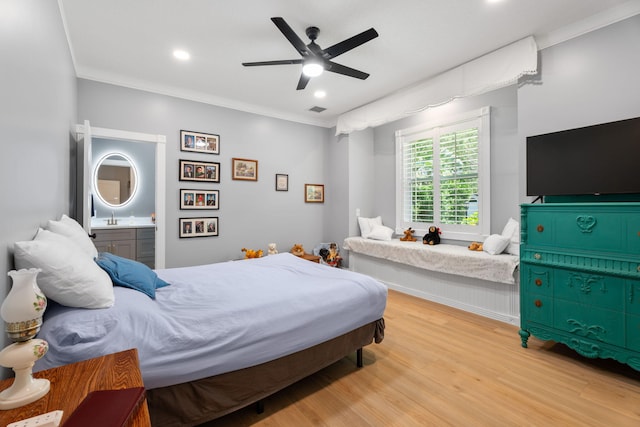 10 Copaire Rd, Sewalls Point, FL 34996 - bedroom featuring light wood finished floors, a ceiling fan, recessed lighting, ensuite bathroom, and a sink