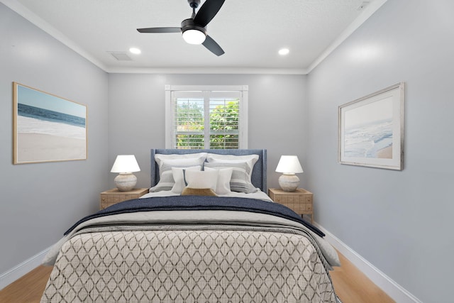 10 Copaire Rd, Sewalls Point, FL 34996 - bedroom featuring light wood-type flooring, baseboards, recessed lighting, ceiling fan, and crown molding