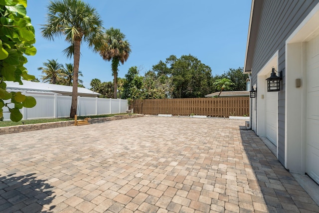 10 Copaire Rd, Sewalls Point, FL 34996 - fenced backyard with a patio area