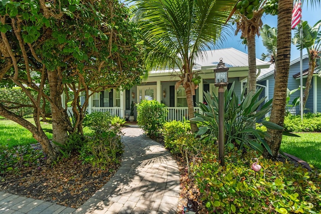 10 Copaire Rd, Sewalls Point, FL 34996 - obstructed view of property with a porch