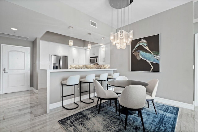 701 S Olive Ave Unit 923, West Palm Beach, FL 33401 - dining room with baseboards and recessed lighting