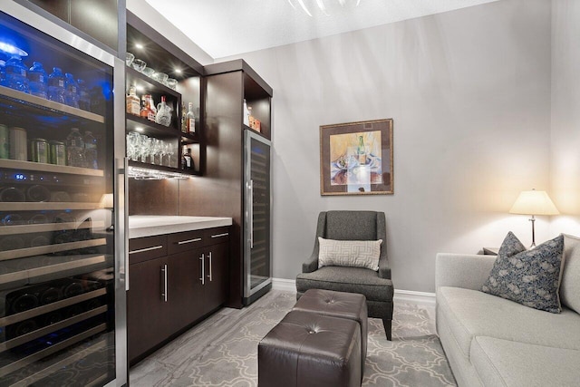 701 S Olive Ave Unit 923, West Palm Beach, FL 33401 - indoor dry bar featuring wine cooler, baseboards, and light marble finish flooring