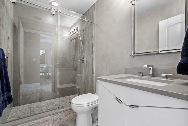 701 S Olive Ave Unit 923, West Palm Beach, FL 33401 - full bathroom featuring vanity, a shower stall, and toilet