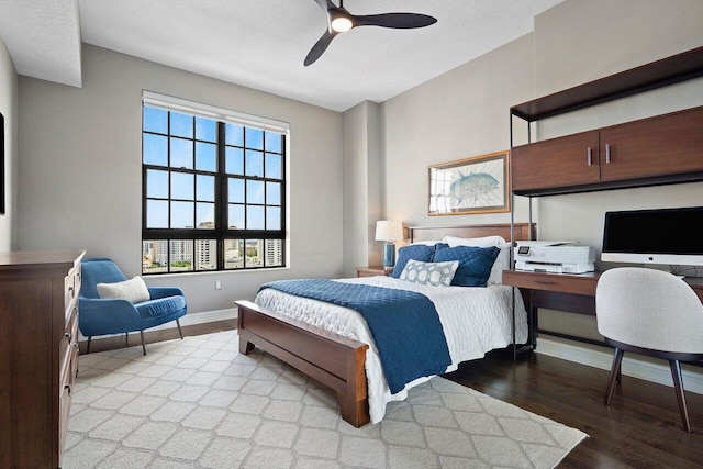 701 S Olive Ave Unit 923, West Palm Beach, FL 33401 - bedroom featuring light wood-style flooring, ceiling fan, baseboards, and a desk