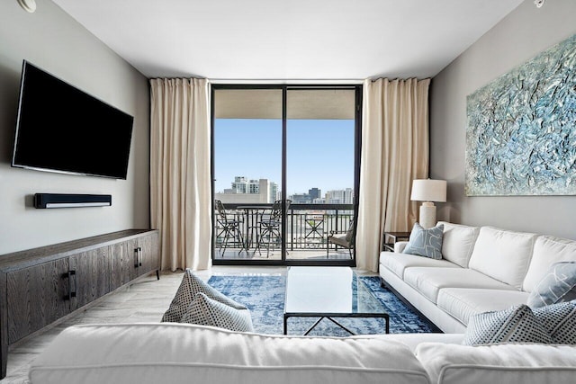 701 S Olive Ave Unit 923, West Palm Beach, FL 33401 - living area with a wall of windows, wood finished floors, and a view of city