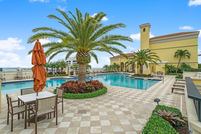 701 S Olive Ave Unit 923, West Palm Beach, FL 33401 - community pool featuring a patio area and outdoor dining space