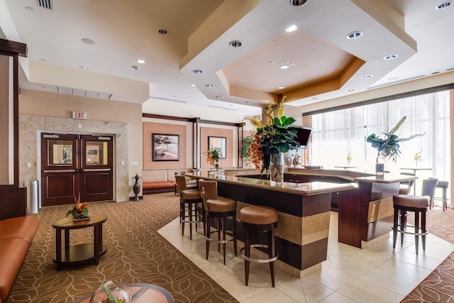 701 S Olive Ave Unit 923, West Palm Beach, FL 33401 - bar area with plenty of natural light, a raised ceiling, recessed lighting, and light tile patterned floors