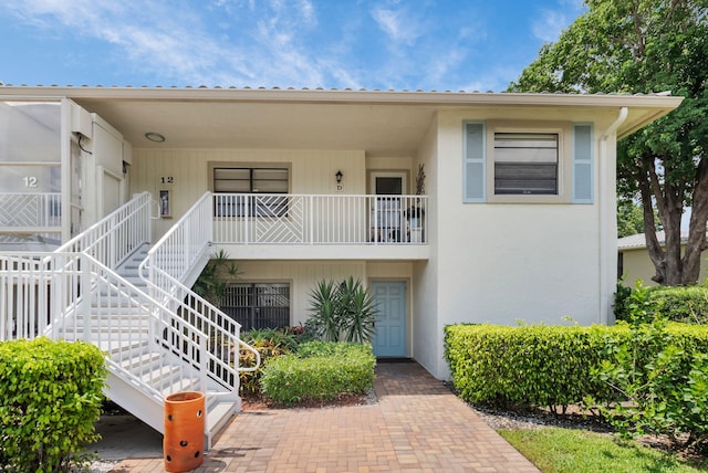 12 Westgate Ln Unit C, Boynton Beach, FL 33436 - view of building exterior with stairway