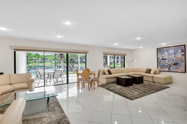 12 Westgate Ln Unit C, Boynton Beach, FL 33436 - living room with recessed lighting and light tile patterned floors