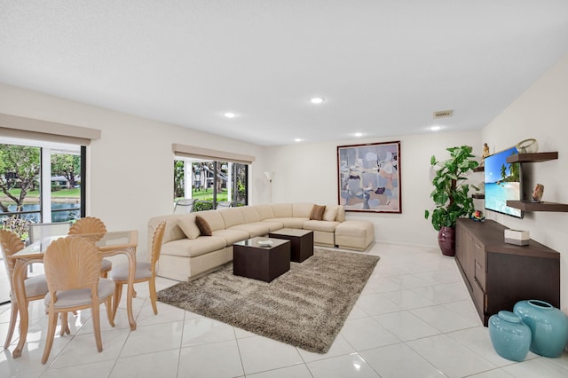 12 Westgate Ln Unit C, Boynton Beach, FL 33436 - living area with plenty of natural light, recessed lighting, and light tile patterned flooring