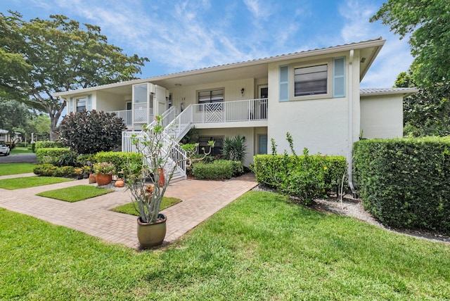 12 Westgate Ln Unit C, Boynton Beach, FL 33436 - view of building exterior featuring stairway