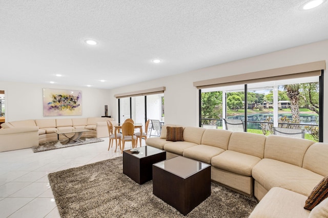12 Westgate Ln Unit C, Boynton Beach, FL 33436 - living area featuring a textured ceiling and recessed lighting