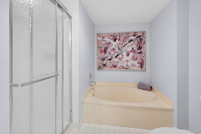 12 Westgate Ln Unit C, Boynton Beach, FL 33436 - full bathroom featuring a shower stall, a garden tub, toilet, and tile patterned floors