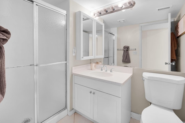12 Westgate Ln Unit C, Boynton Beach, FL 33436 - full bath featuring toilet, a shower stall, vanity, and tile patterned floors
