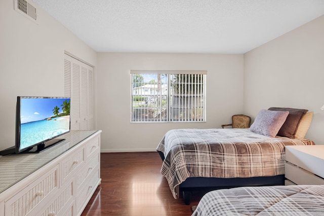 12 Westgate Ln Unit C, Boynton Beach, FL 33436 - bedroom featuring dark wood finished floors and baseboards