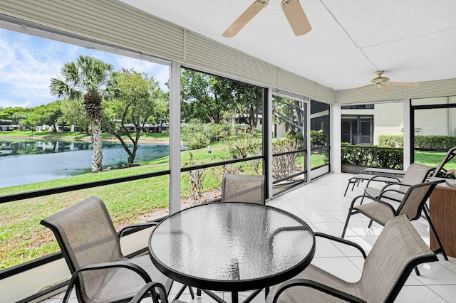 12 Westgate Ln Unit C, Boynton Beach, FL 33436 - sunroom / solarium featuring ceiling fan, a water view, and outdoor dining space