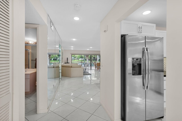 12 Westgate Ln Unit C, Boynton Beach, FL 33436 - hallway featuring light tile patterned flooring and recessed lighting