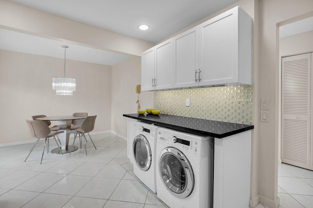 12 Westgate Ln Unit C, Boynton Beach, FL 33436 - laundry room featuring washing machine and dryer, a chandelier, baseboards, light tile patterned floors, and recessed lighting