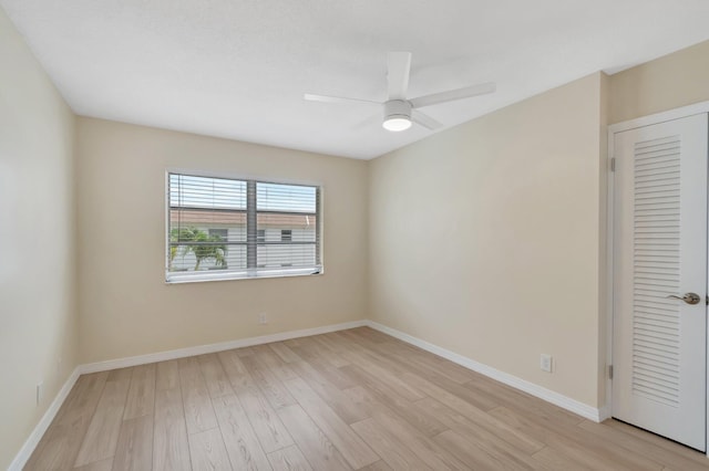 51 Stratford D, West Palm Beach, FL 33417 - unfurnished bedroom with light wood finished floors, baseboards, and a ceiling fan