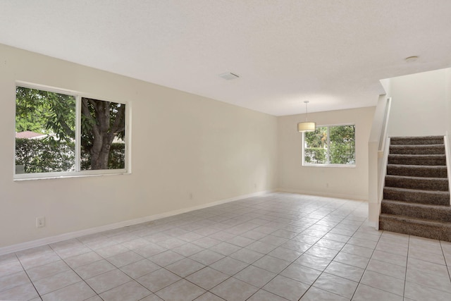 4667 SW 12th Ct, Deerfield Beach, FL 33442 - unfurnished room featuring light tile patterned floors, stairway, and baseboards