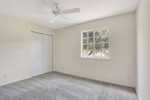 4667 SW 12th Ct, Deerfield Beach, FL 33442 - unfurnished bedroom featuring carpet flooring, a closet, a textured ceiling, ceiling fan, and baseboards