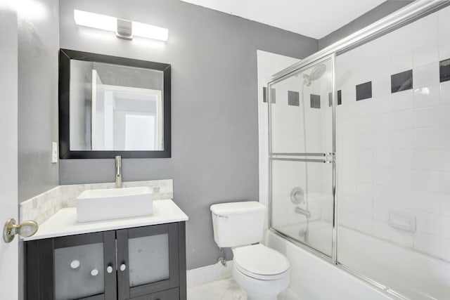 4667 SW 12th Ct, Deerfield Beach, FL 33442 - bathroom with toilet, vanity, enclosed tub / shower combo, and baseboards