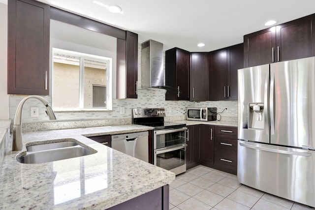 4667 SW 12th Ct, Deerfield Beach, FL 33442 - kitchen with stainless steel appliances, wall chimney range hood, a sink, light tile patterned floors, and light stone counters