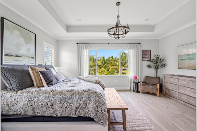 12277 Waterstone Cir, Palm Beach Gardens, FL 33412 - bedroom featuring a raised ceiling, wood finished floors, a chandelier, baseboards, and ornamental molding
