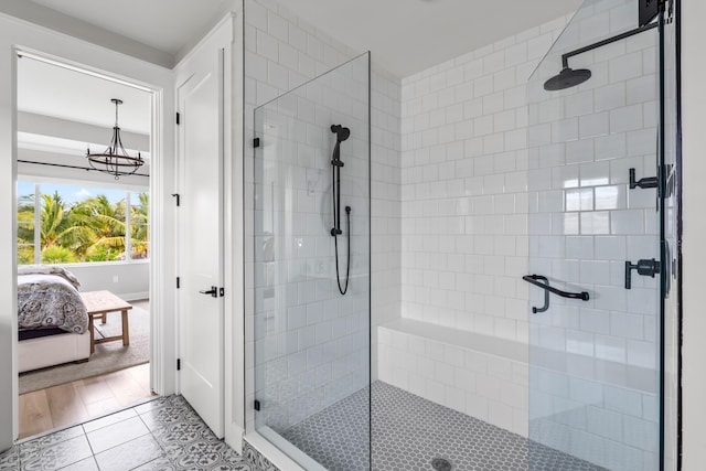 12277 Waterstone Cir, Palm Beach Gardens, FL 33412 - ensuite bathroom with a stall shower and tile patterned floors