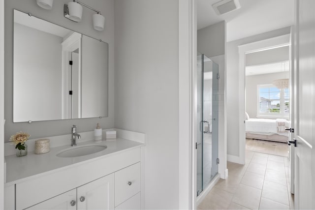 12277 Waterstone Cir, Palm Beach Gardens, FL 33412 - ensuite bathroom featuring vanity, a shower stall, and tile patterned flooring