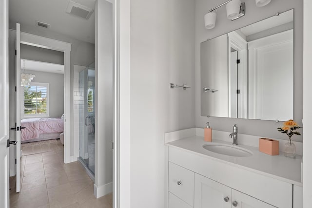 12277 Waterstone Cir, Palm Beach Gardens, FL 33412 - ensuite bathroom with vanity, a stall shower, and tile patterned floors