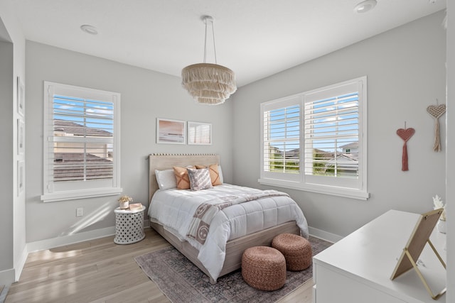 12277 Waterstone Cir, Palm Beach Gardens, FL 33412 - bedroom featuring baseboards and light wood-style flooring