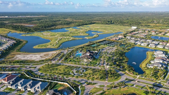 12277 Waterstone Cir, Palm Beach Gardens, FL 33412 - aerial view of property and surrounding area featuring nearby suburban area, a large body of water, and a heavily wooded area