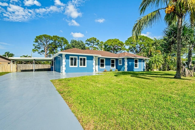 5031 Van Buren Rd, Delray Beach, FL 33484 - ranch-style home with a carport, driveway, and stucco siding