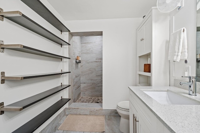 5031 Van Buren Rd, Delray Beach, FL 33484 - bathroom featuring a walk in shower, toilet, vanity, and marble finish floors