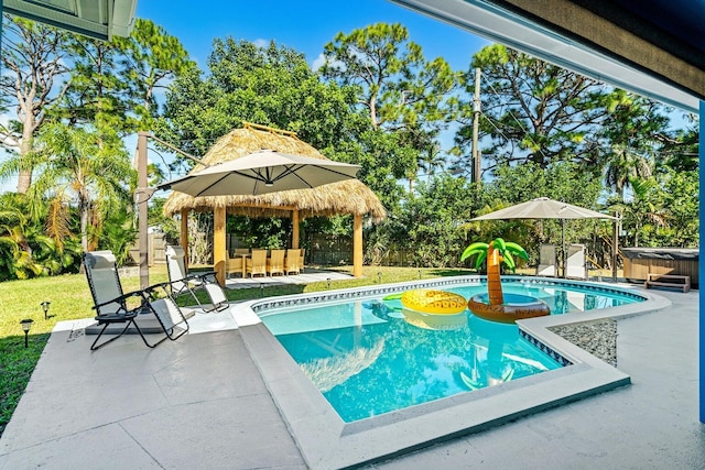 5031 Van Buren Rd, Delray Beach, FL 33484 - outdoor pool featuring a hot tub, a patio area, and a fenced backyard