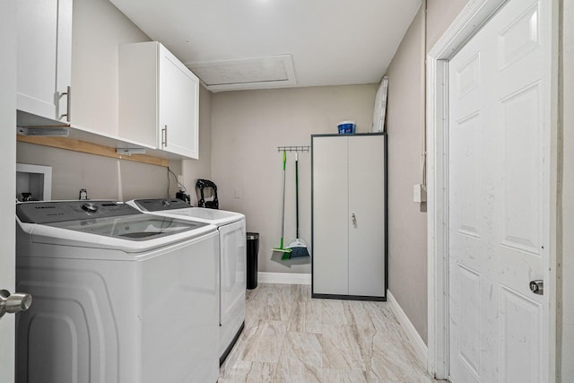 5031 Van Buren Rd, Delray Beach, FL 33484 - laundry room featuring cabinet space, washing machine and dryer, baseboards, light marble finish flooring, and attic access