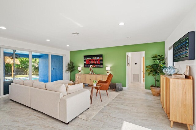 5031 Van Buren Rd, Delray Beach, FL 33484 - living room featuring recessed lighting, baseboards, and light marble finish flooring