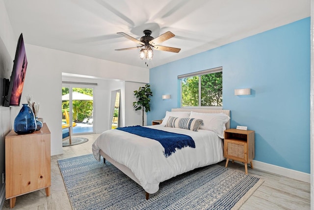 5031 Van Buren Rd, Delray Beach, FL 33484 - bedroom with access to exterior, multiple windows, a ceiling fan, and baseboards