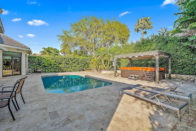 125 Pembroke Dr, Palm Beach Gardens, FL 33418 - view of pool with a hot tub, a patio, and a fenced backyard