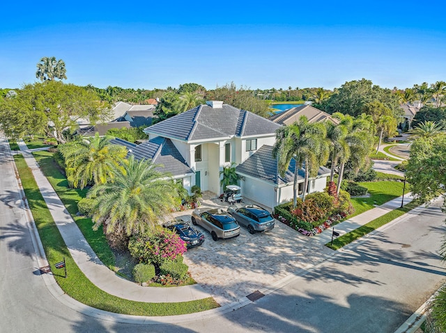 125 Pembroke Dr, Palm Beach Gardens, FL 33418 - view of front of property with stucco siding and driveway