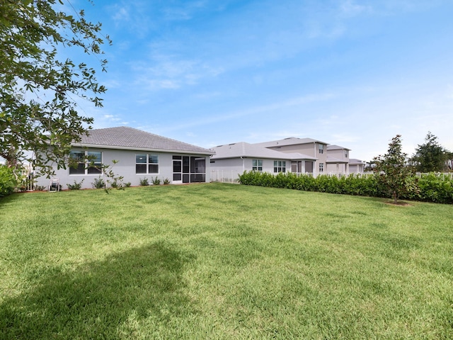 10621 SW Morning Glory Dr, Port Saint Lucie, FL 34987 - view of green lawn with a sunroom