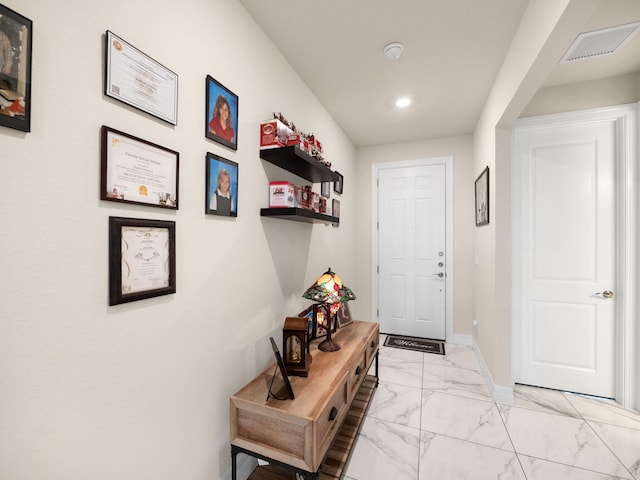 10621 SW Morning Glory Dr, Port Saint Lucie, FL 34987 - entryway featuring light marble finish flooring, recessed lighting, and baseboards